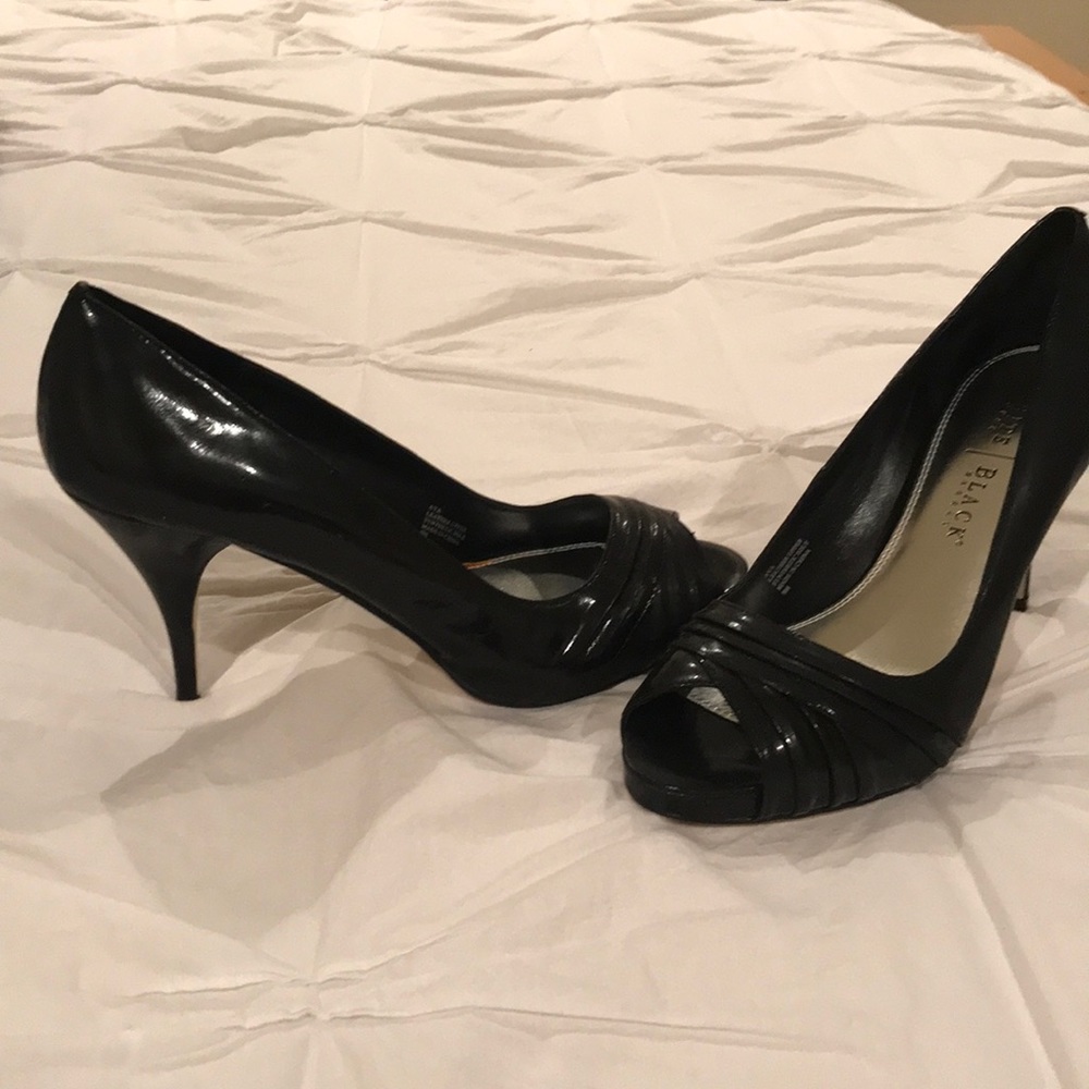 Woman’s black leather upper high heel shoes